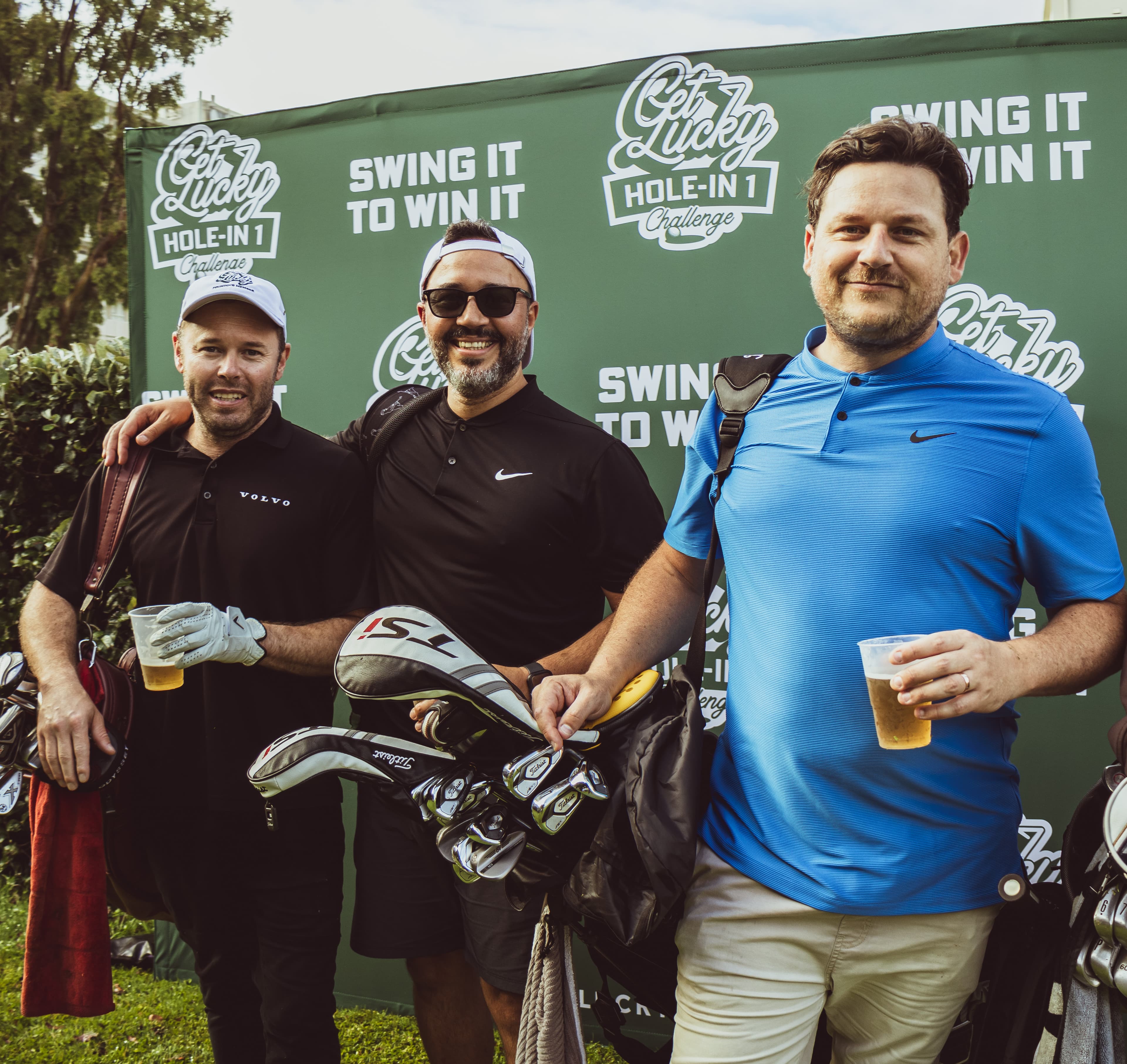 Three golfers with beers at the Get Lucky challenge