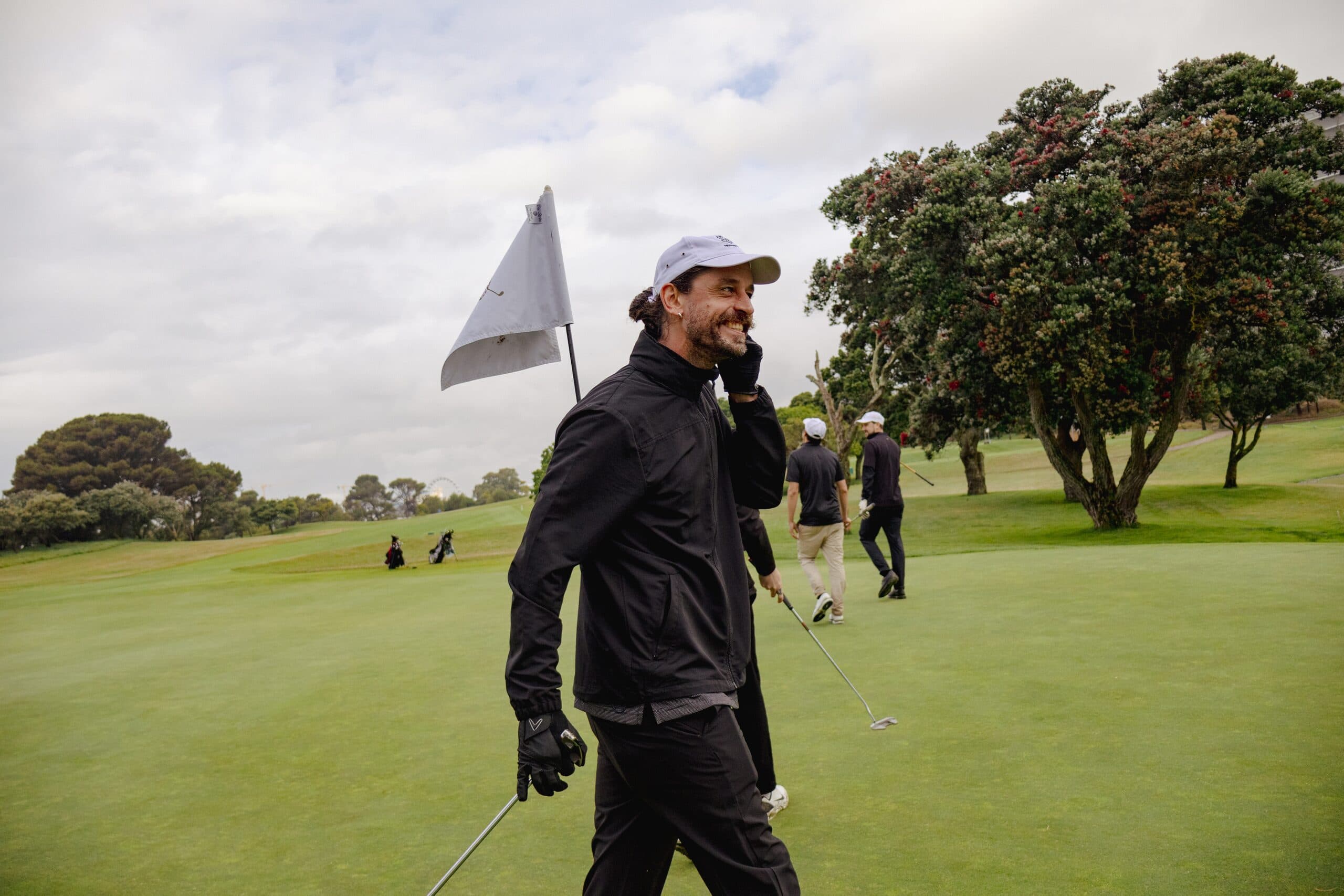 Golfer on the green with the flag